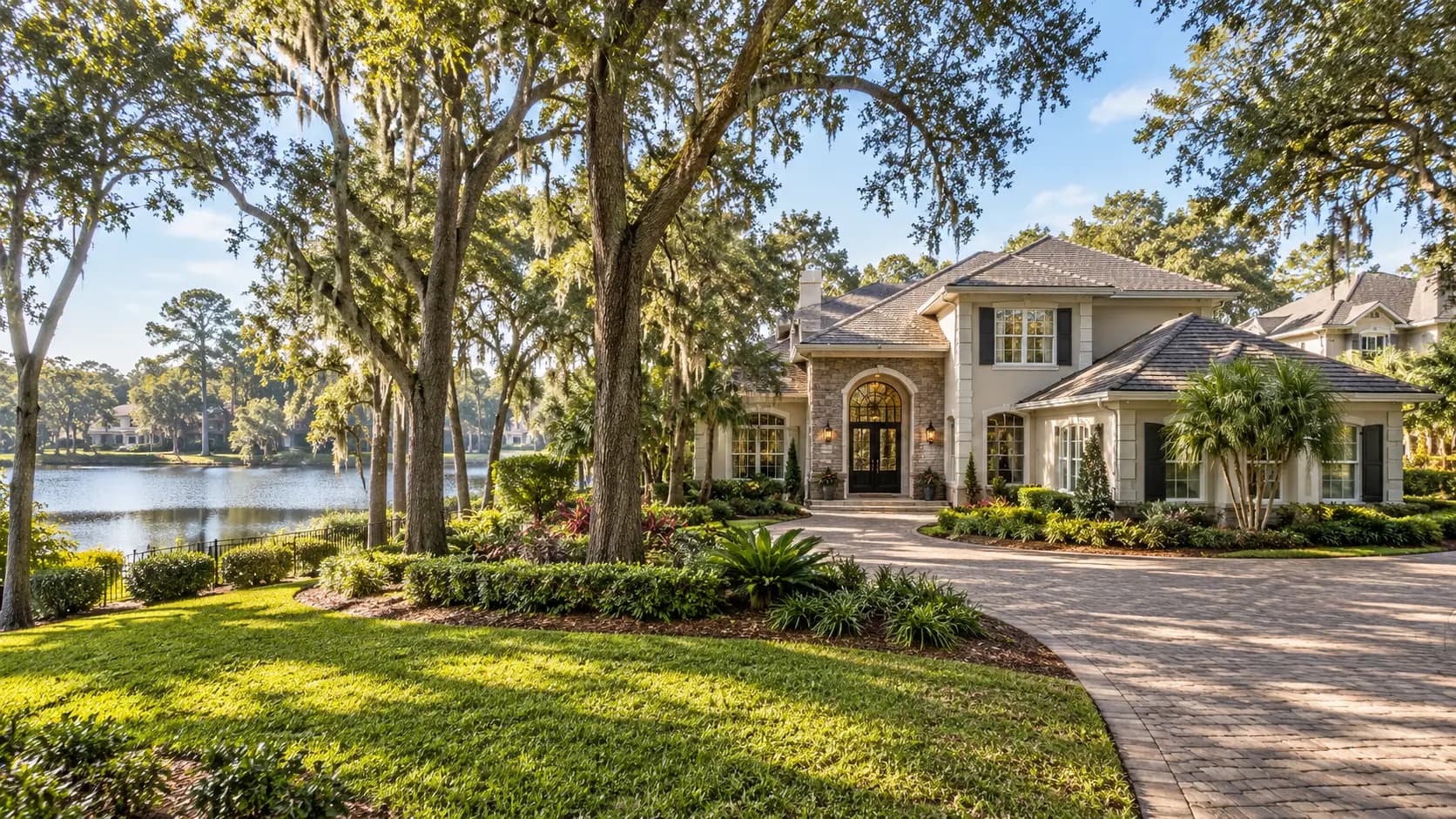 Two-story home on a wooded lot beside a lake in a gated community in the Deerwood area of Jacksonville